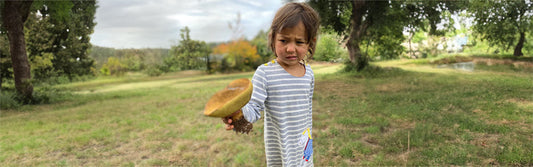 Isa Pevec holding a mushroom